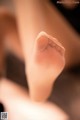 A close up of a woman's foot with a pair of socks.