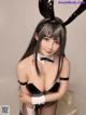 A woman in a bunny costume posing for a picture.