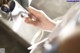 A close up of a person's hand holding a cell phone.